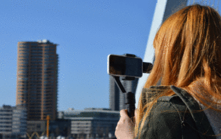 Girl videoing an urban landscape