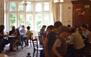 Families gathered in the Bletchly Park Mansion House Dining room 2018