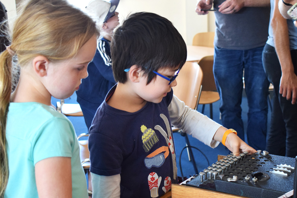 two children working the Enigma machine at Bletchley Park