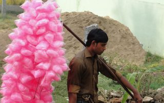 A candyfloss vendor in India by Thamizhpparithi Maari