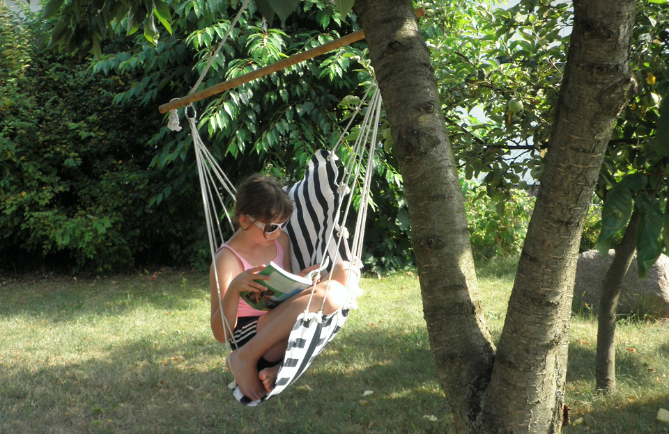 Girl reading in a hammock