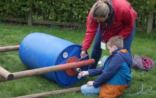 Mother and child creating a rolling racing buggy at the PPUK Be Curious Weekend 2019