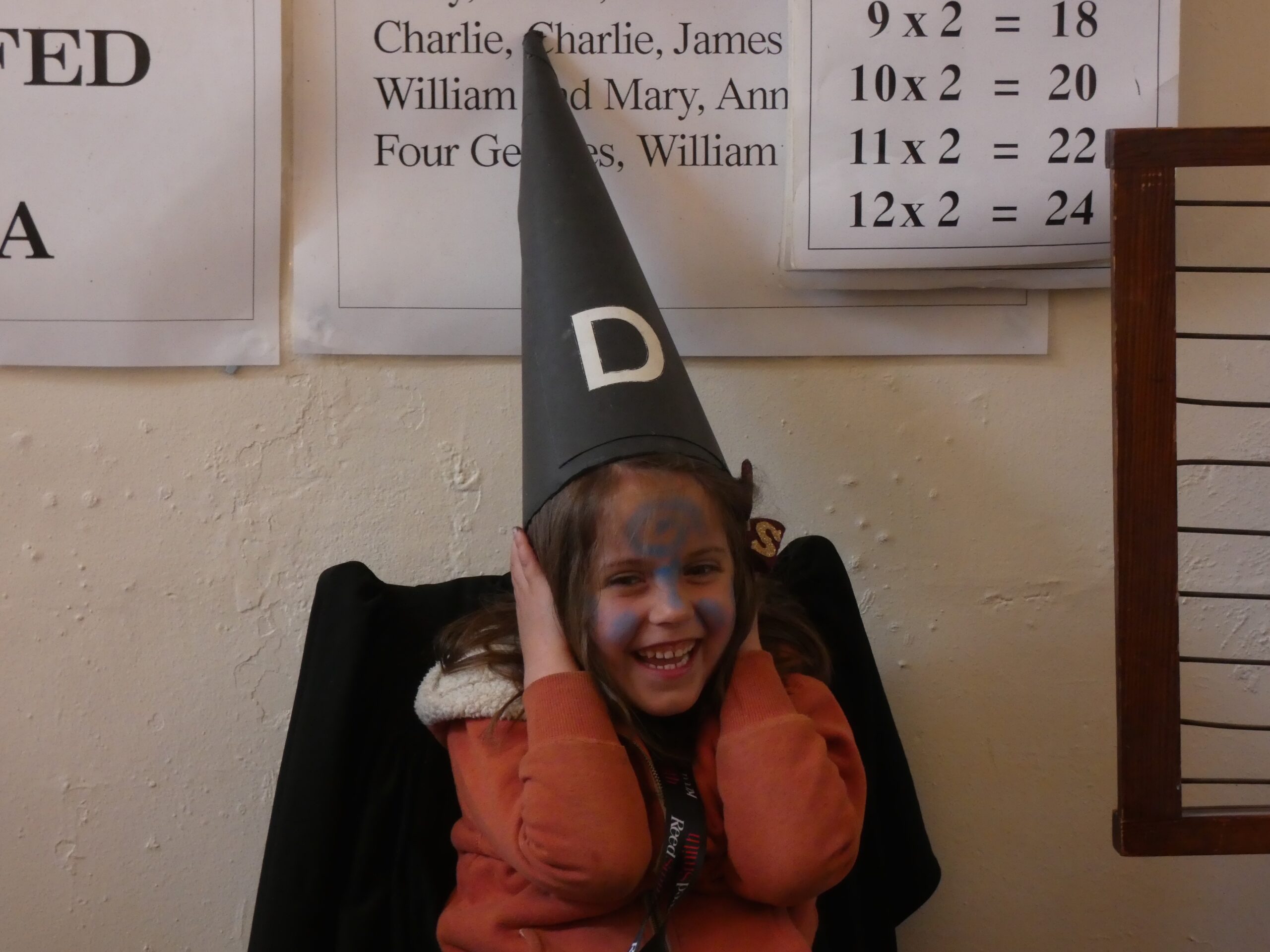 Girl trying out Dunce cap at the PPUK Be Curious Weekend 2019
