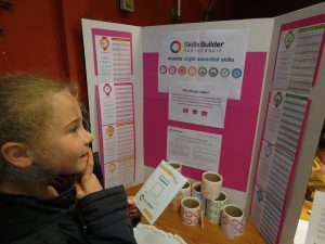 Girl checking out which Skills Builder skills she has done in her activity. At PPUK Be Curious Weekend 2019