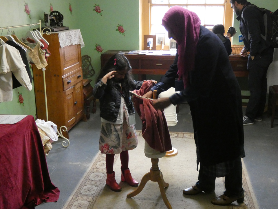 mother and child discovering Victorian clothing at the PPUK Be Curious Weekend 2019