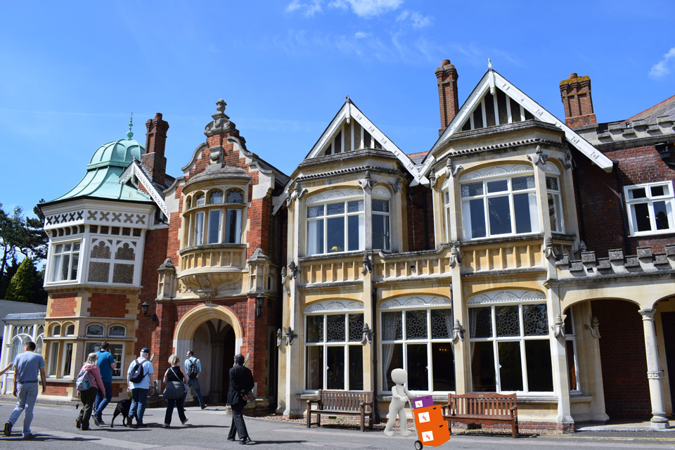 The Mansion House, Bletchley Park - with a 3d figure moving Potential Plus UK boxes on a porter's trolley