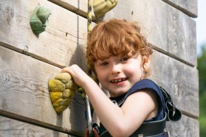 Young girl on a climbing wall