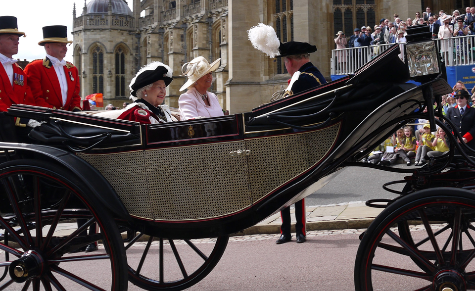 The Queen, Prince Charles and Camilla, Duchess of Cornwall riding in a carriage at Garter Day 2019