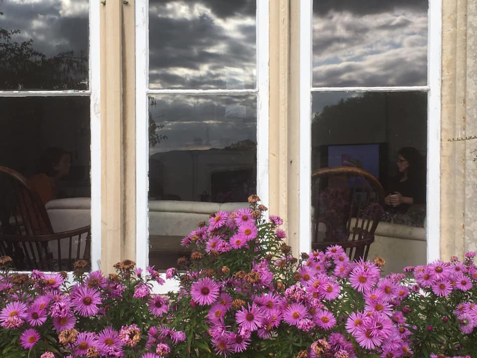 Hawkwood College Window with Michaelmas Daisies outside it