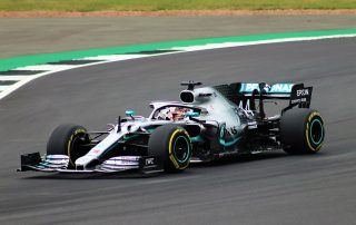 Lewis Hamilton Racing Car on Track