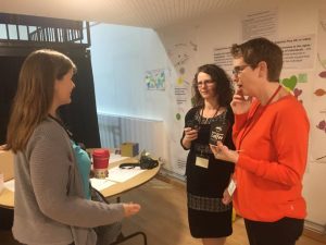 Rebecca Howell talking with a parent and volunteer at Potential Plus UK's BIG Family Weekend, 2019