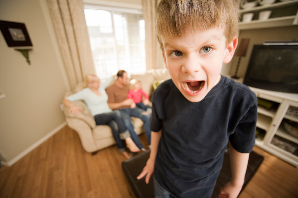 A young boy screaming