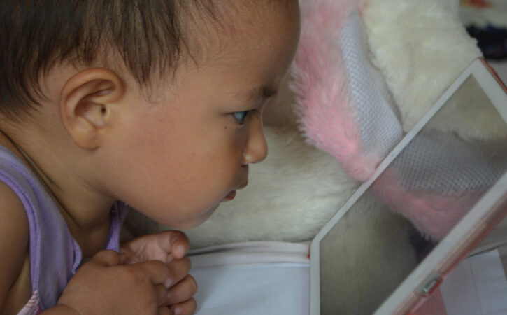 young girl staring at a computer screen