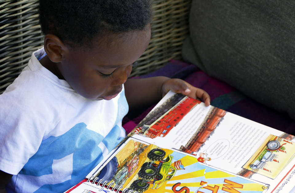 Young child reading a book