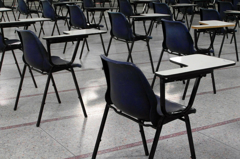 School hall, empty except for chairs set out for exam