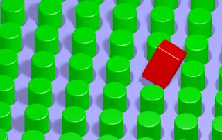 red square peg on board of green round pegs