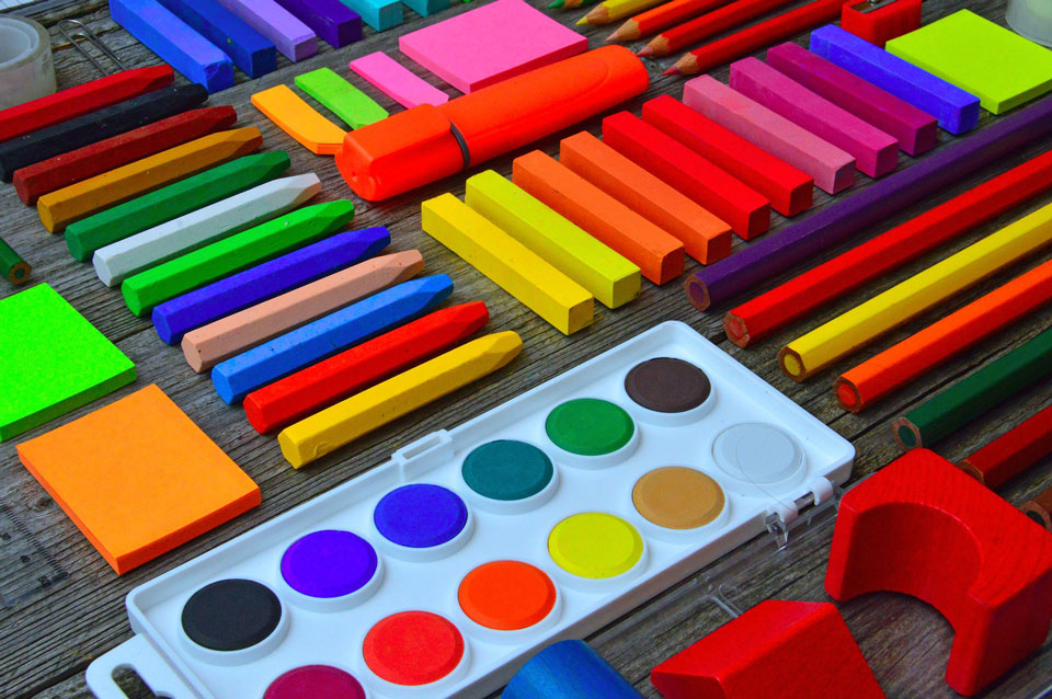 Colouring pencils, pastels, paints lined up