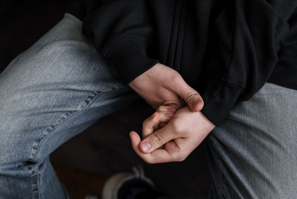 closeup of teenagers hands expressing anxiety