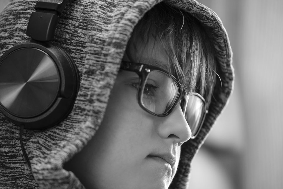 boy in a hoodie with headphones