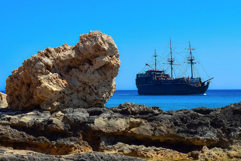Old fashioned pirate ship seen from the shore in Cyprus