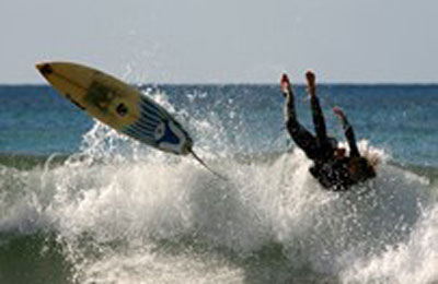 teenager surfing wipeout