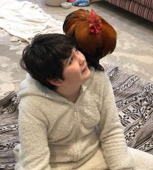 Sam and chicken on his shoulder