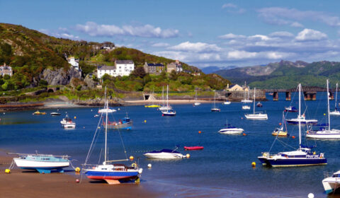 Boats, some beached and some floating at Barmouth