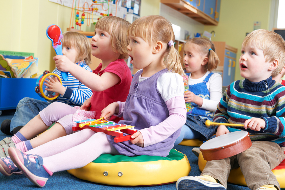 nursery children having a music lesson