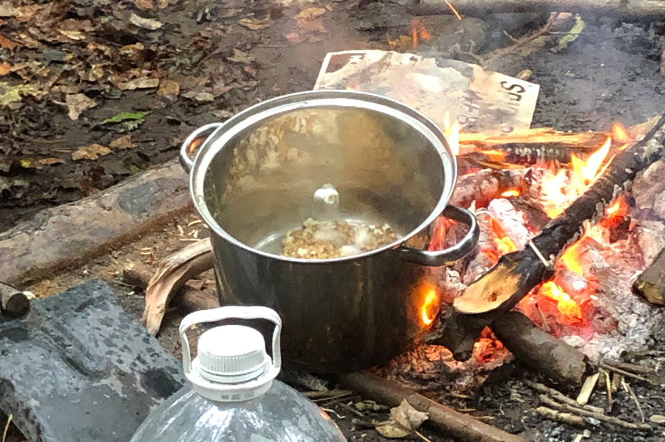 Popping corn over an open fire at Lea Green Centre, Let's Explore Day, October 2021