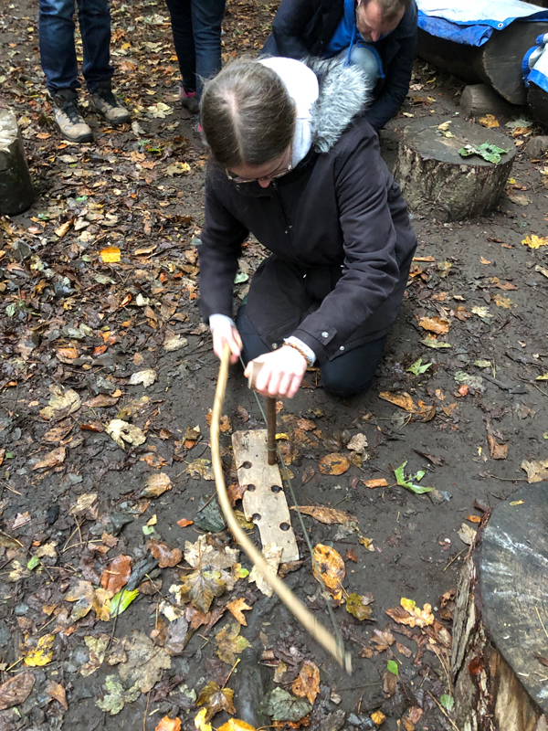 Using a bow to make fire at Lea Green Centre, Let's Explore Day, October 2021