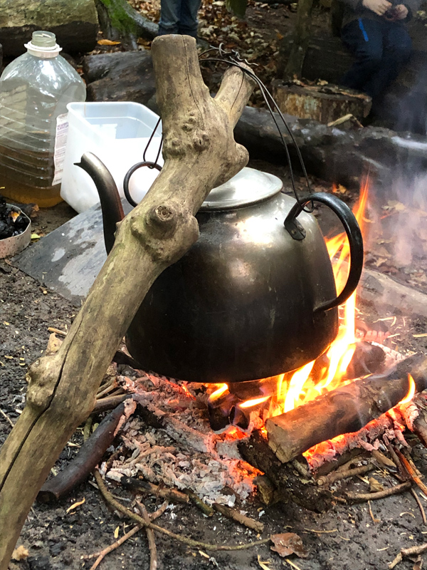 Kettle hanging over an open fire at Lea Green Centre, Let's Explore Day, October 2021