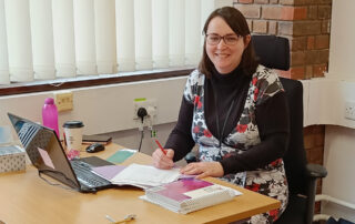 Potential Plus UK assessor Claire at her desk