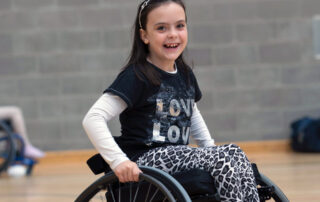 Smiling girl in a wheelchair