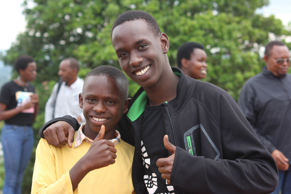 two boys with thumbs up