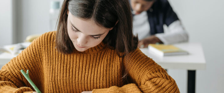 children sitting working at desks